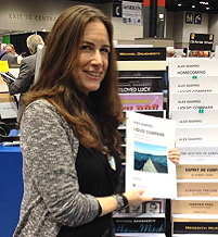 Alexwith some of her music at the Hal Leonard rack at the Midwest Clinic, 2014.